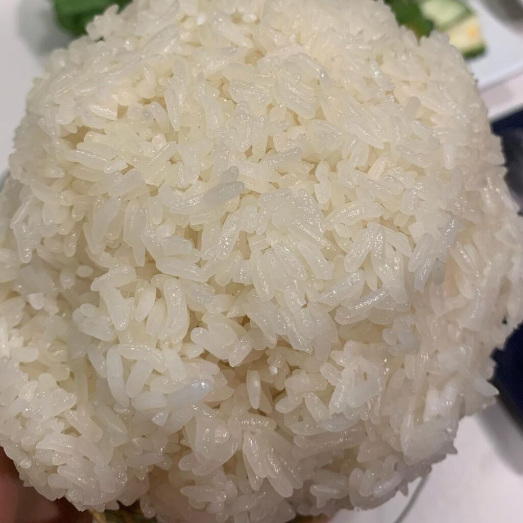 a bundle of fresh khao niaw sticky rice which is traditional laos food